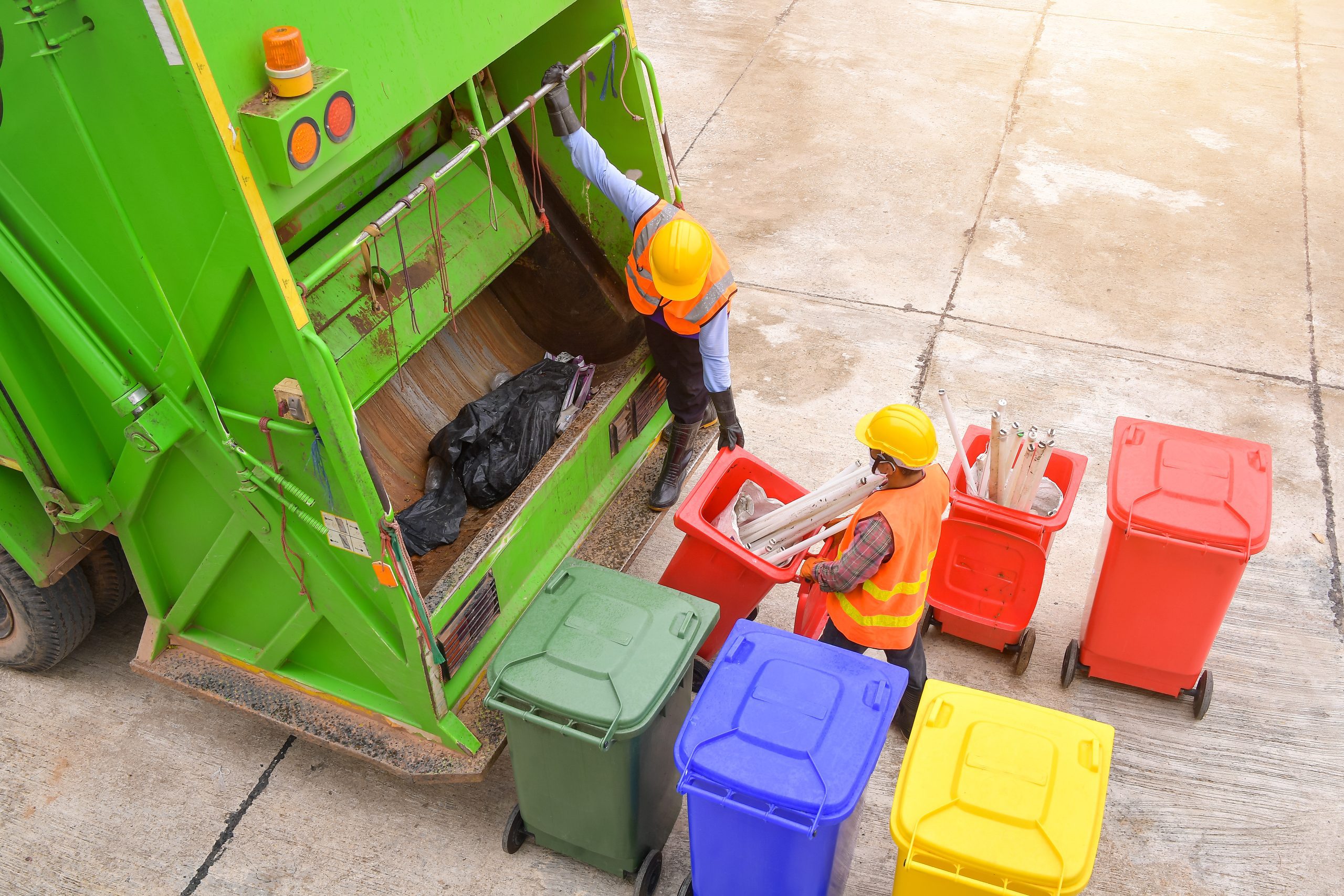 Workers collect garbage with Garbage collection truck